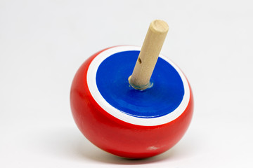 wooden top spinning, isolated on natural white background. children toy.