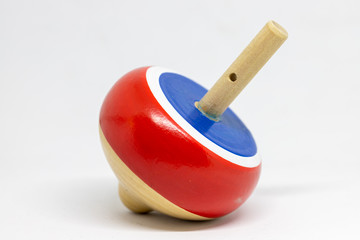 wooden top spinning, isolated on natural white background. children toy.