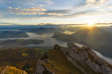 Beautiful sunrise panoramic view on Swiss Alps around Lake Lucerne as seen from top of Pilatus Kulm peak
