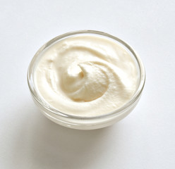 Cream swirl in bowl on white