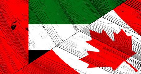 Flag of the United Arab Emirates and Canada on wooden boards