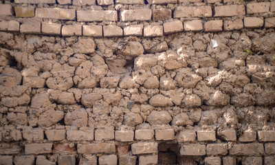 The texture of the wall of clay brick.