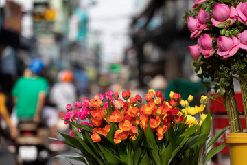 A flower shop on a busy market street in Ho Chi Minh City Vietnam