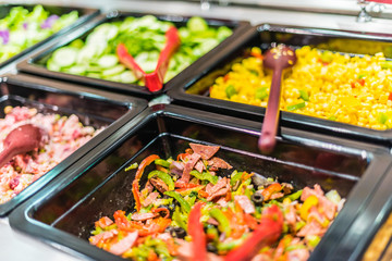 Assortment of fresh vegetable salads in restaurant buffet