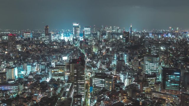Breathtaking view of Tokyo at night. Futuristic city skyline timelapse. Zoom out