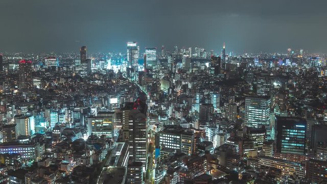 Breathtaking view of Tokyo at night. Futuristic city skyline timelapse. Zoom in.