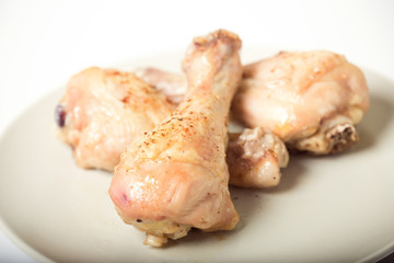Baked chicken legs on plate