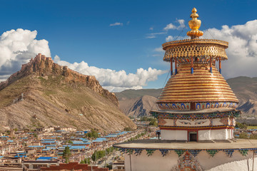 Magnificent Kumbum Stupa in Gyantse with Dzong fortress in background, Tibet