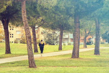 woman training outside in city park. On the right there is a defocused zone designed to insert text or graphics