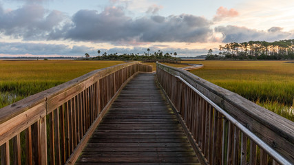 Boardwalk over the salt marsh at sunrise