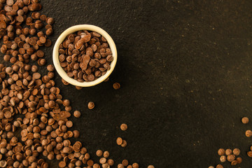 chocolate drops (black or milk chocolate, sweet ingredient) menu concept. food background. copy space. Top view