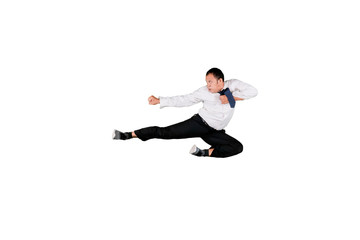 Aggressive Asian businessman doing kung fu kick in mid air