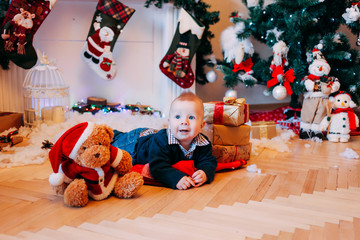 Christmas, New Year, winter and holidays seasons concept. Little boy at home