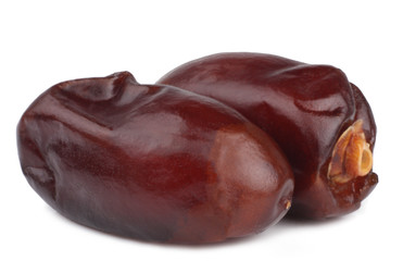 Dates on white background, top view, macro