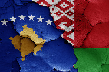 flags of Kosovo and Belarus painted on cracked wall