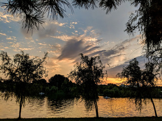 Sunset over the lake in Alexandru Ioan Cuza Park, Bucharest