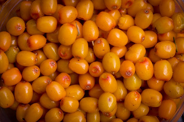 Sea buckthorn. Background of ripe berries. Sea buckthorn berries close-up.