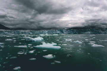 Columbia glacier, Alaska, passing through ice filled waters and mountains