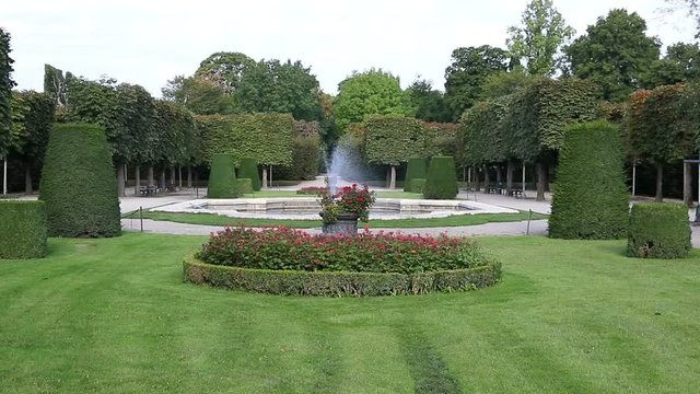 beautiful garden with fountain trees and flowers in Vienna Austria 