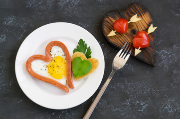 Valentine's day Breakfast is scrambled eggs with heart-shaped bread. The view from the top