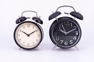 Alarm clock on white background. Selective focus.