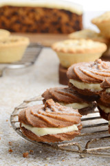 closeup gingerbread swirl cookies with christmas baking in background