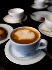 cup of cappuccino on the table