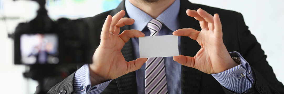 Bisnessman hold business card in hand