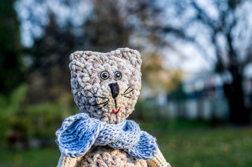 Knitted striped handmade crafted cat.