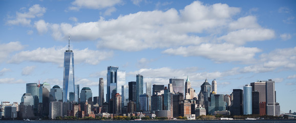 The stunning skyline of New York City as seen from ellis island, in a sunny day of october.