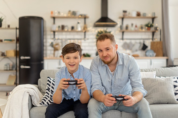 Father and son funny played on game console and son is win
