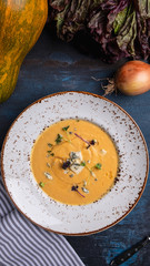 Delicious pumpkin soup with blue cheese. Top view