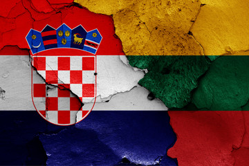 flags of Croatia and Lithuania painted on cracked wall