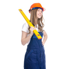 Woman builder with work helmet holding building level on white background isolation