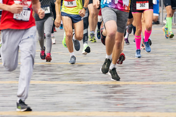Fototapeta na wymiar Marathon runners. Marathon running race in city streets.