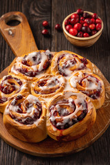 Homemade cranberry and orange swirl buns with glaze.