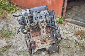Fototapeta na wymiar dismantled car engine. disassembly of broken cars