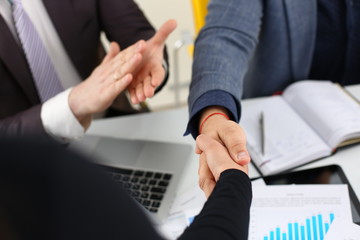 young happy businessmen have meeting in office shake hands with each other