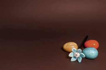 Blue glass flower and colorful easter eggs