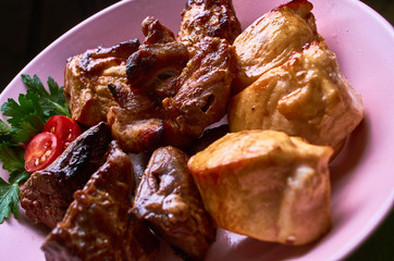 Barbecue meat set on plate with parsley.