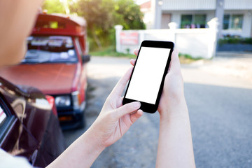 Cropped shot view of business woman’s hands holding the mobile phone with blank copy space screen for your information content or text message, the woman reading text message on the smart phone during