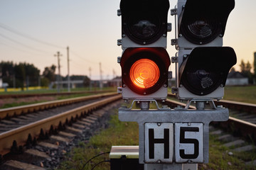 Traffic light show red signal on a railway, close up