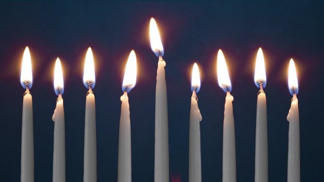 Video Of Eight Lit Hanukkah Candles ON GRUNGE BACKGROUND And Shamash