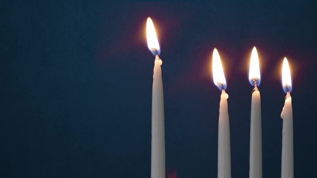 Video Of Three Lit Hanukkah Candles ON GRUNGE BACKGROUND And Shamash
