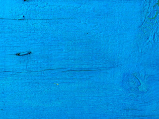 Obraz premium texture of old painted shabby rustic wooden fence made of planks, with rusty nails, grunge background