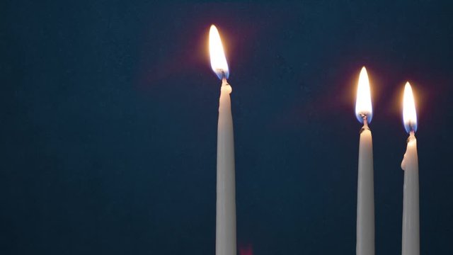 Video Of Two Lit Hanukkah Candles ON GRUNGE BACKGROUND And Shamash