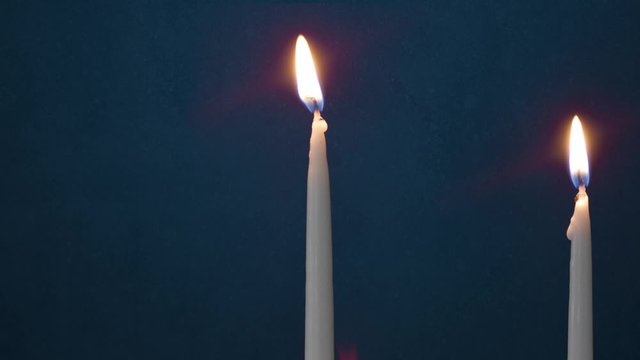 Video Of One Lit Hanukkah Candle ON GRUNGE BACKGROUND And Shamash