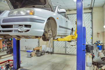 old car lifted on a car lift