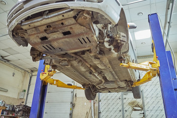 old car lifted on a car lift