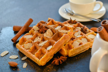 Warm Belgian waffles with almonds and cinnamon. The dough contains mashed persimmon.